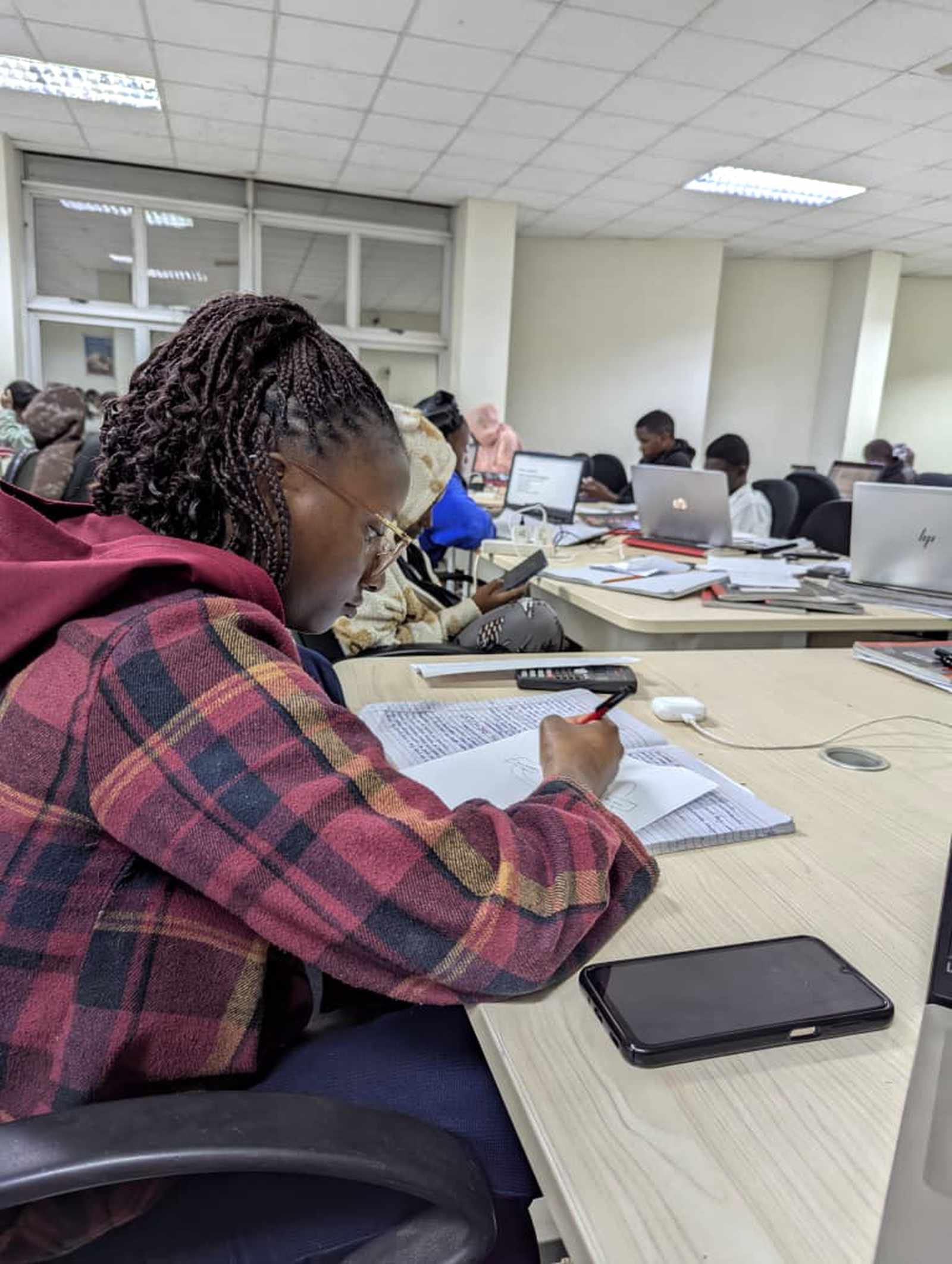 Business & Marketing student, Muma, studying in the library at her university in Zambia.