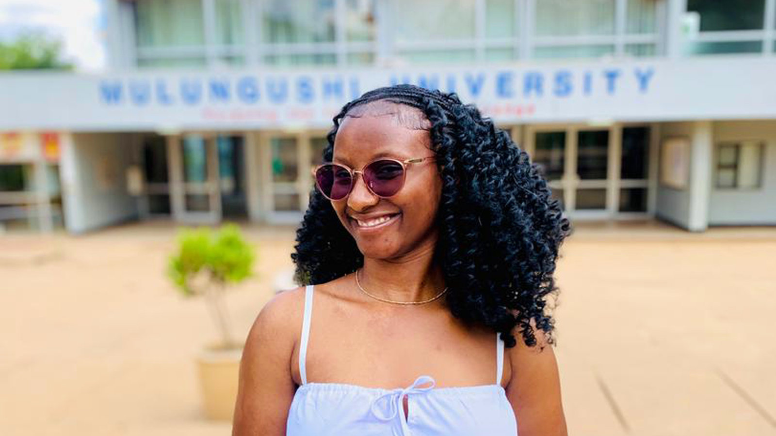 A sponsored student outside Mulungushi University in Zambia