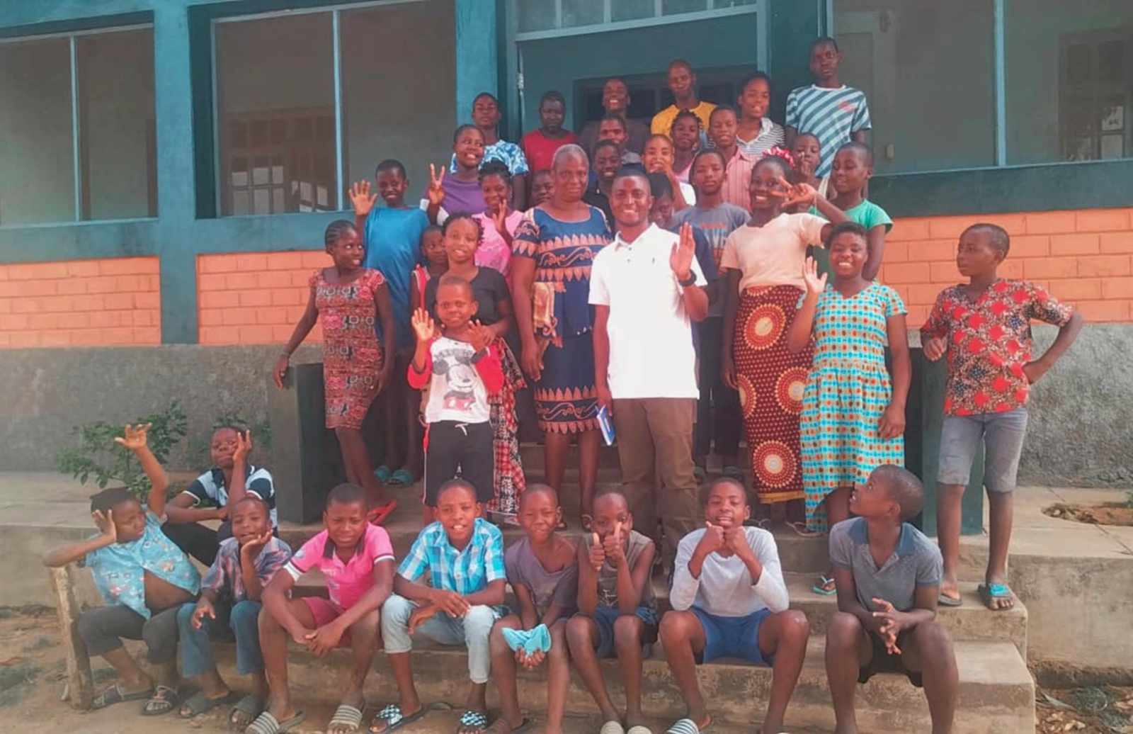 Jossias, one of our medical team members, with children at a Mozambican orphanage after leading a health-education session and sharing about Jesus