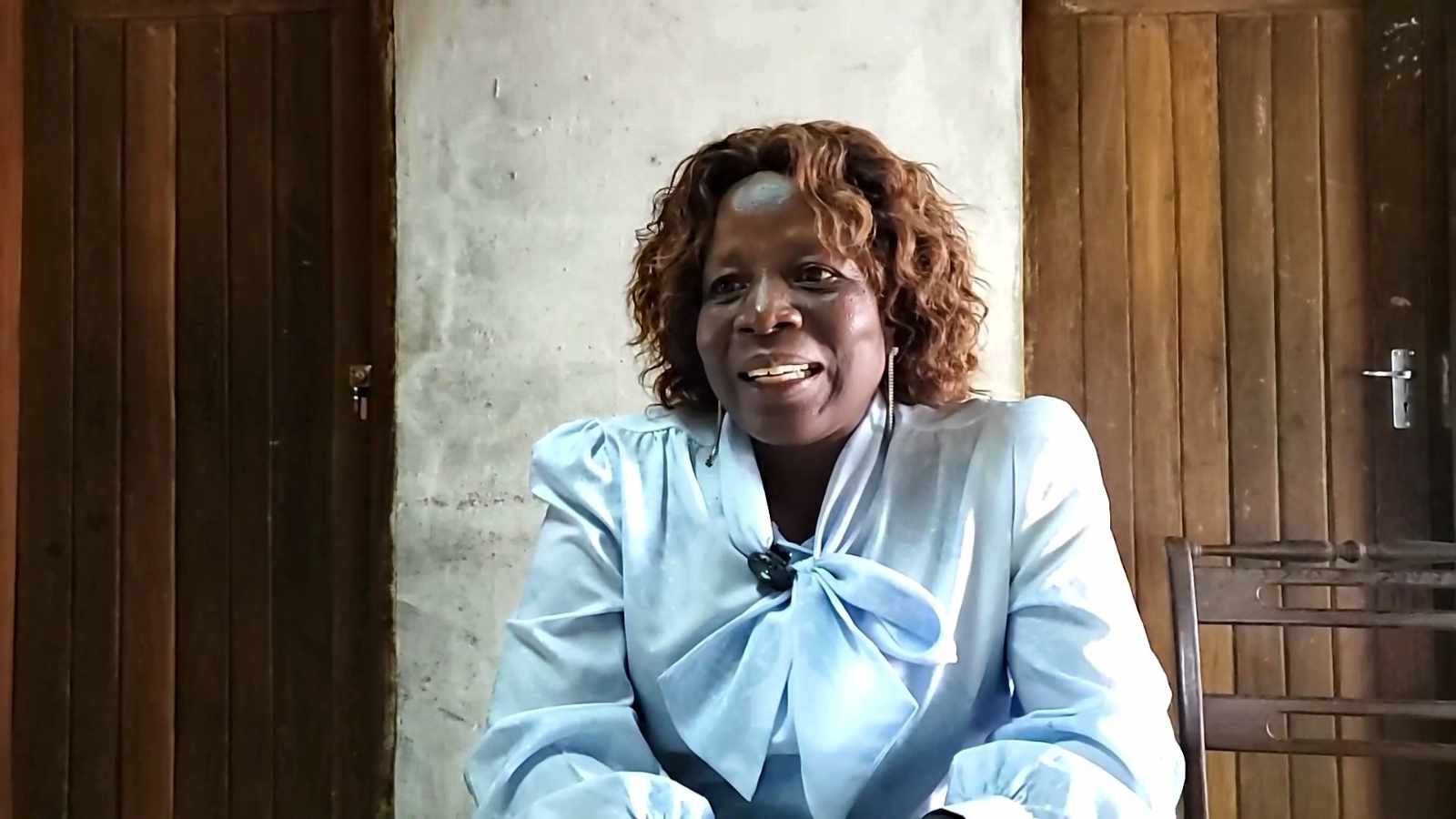 A woman in rural Mozambique sharing her testimony of the care she received from Hope of a Nation's medical home-visit team